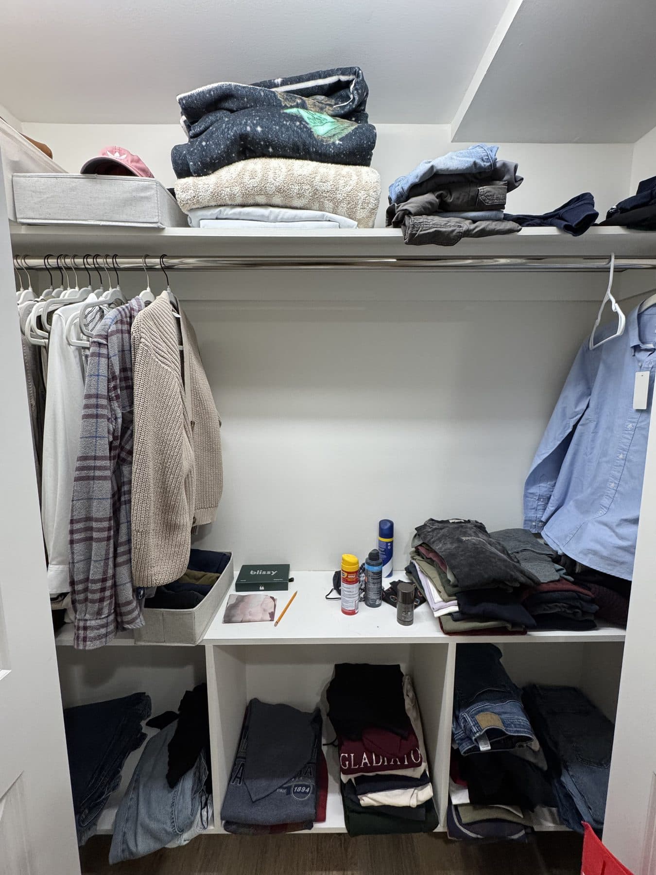 Cluttered closet before IZEN home organization in Fairfield County