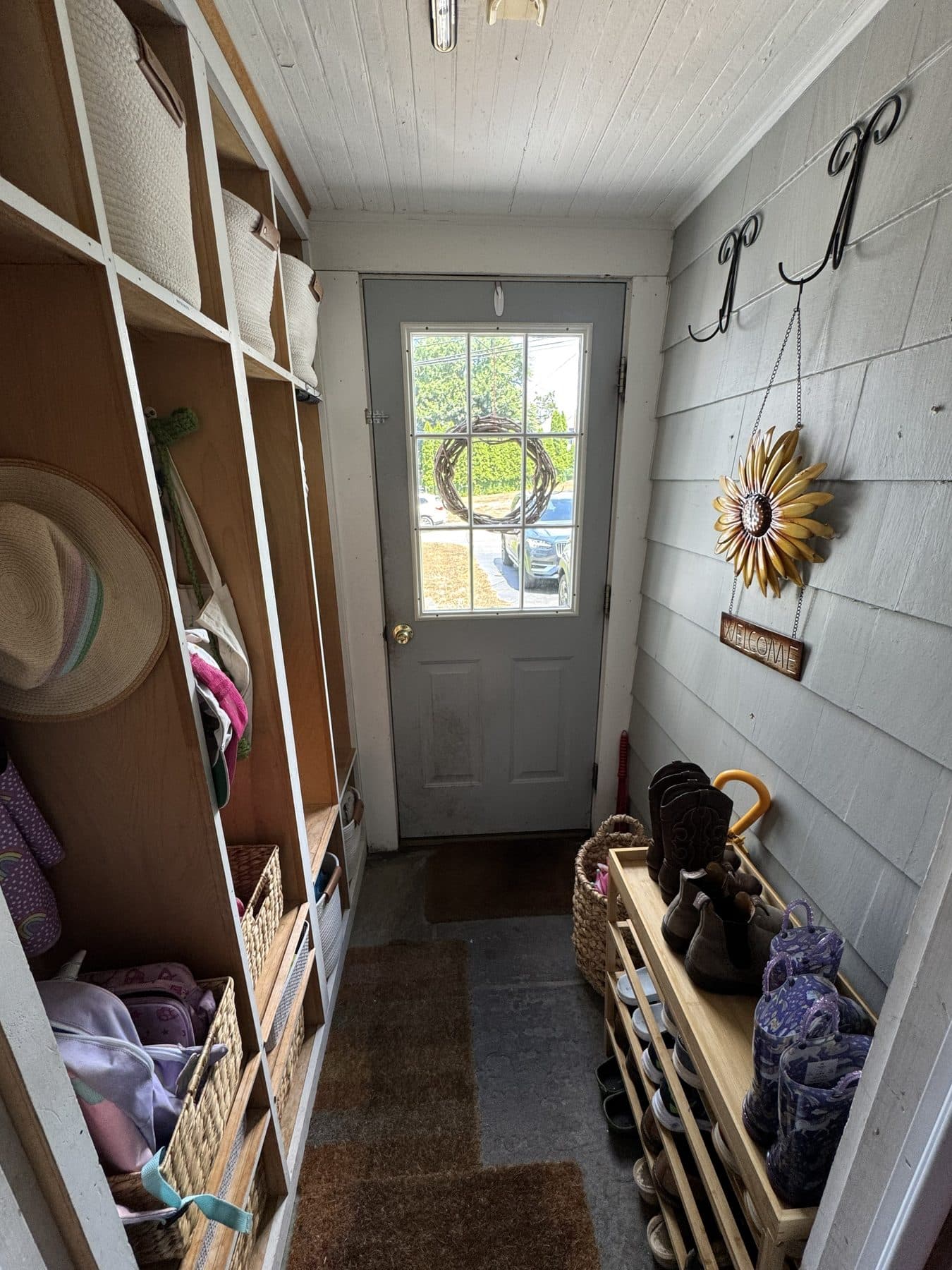 A calm, minimal mud room after an IZEN organizing session